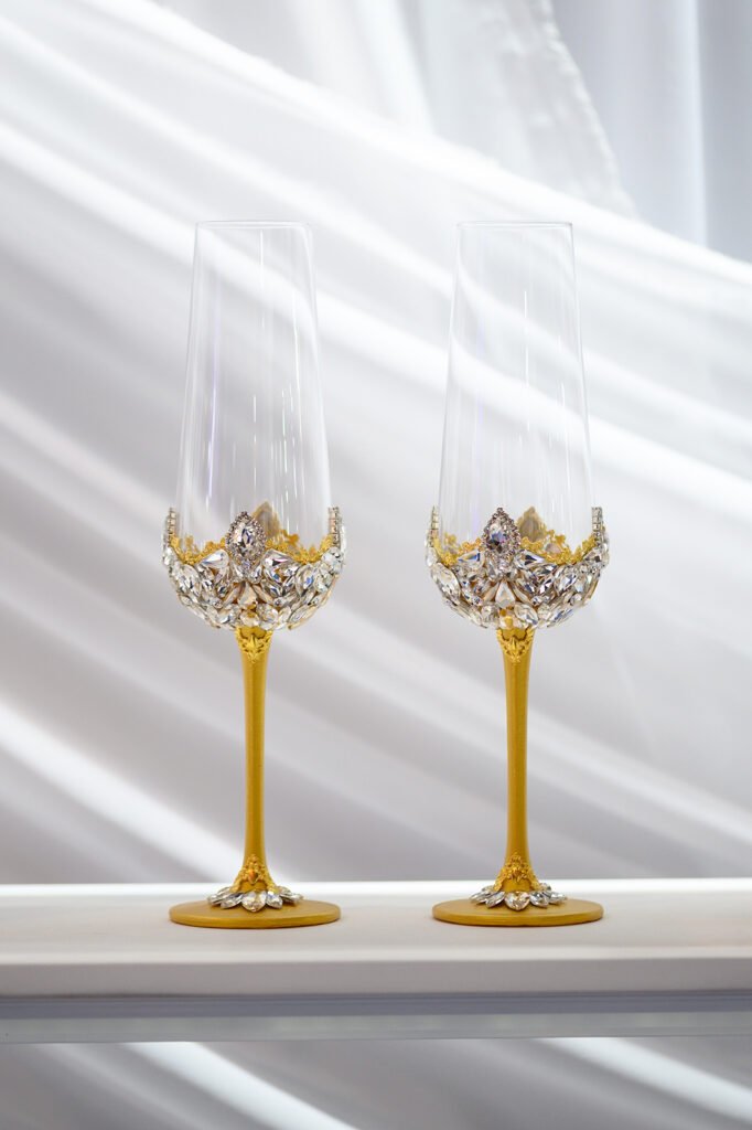 Aurelia Collection crystal wedding set with golden metallic tones and delicate shimmering crystal details